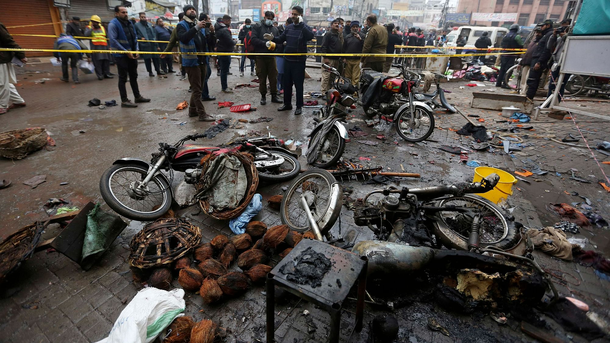 <div class="paragraphs"><p>Lahore: Police officials examine the site of bomb explosion, in Lahore, Pakistan on Thursday, 20 January.<br></p></div>