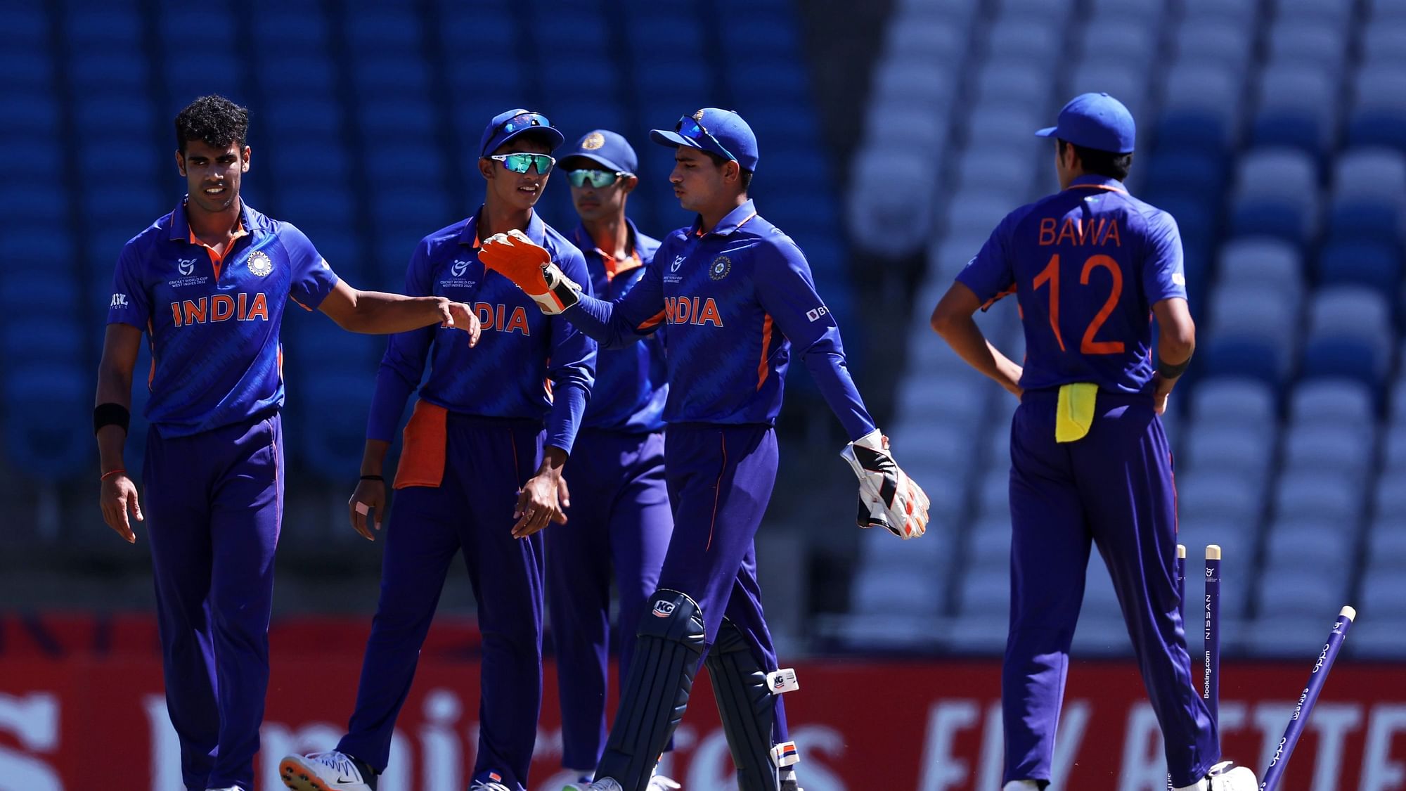 <div class="paragraphs"><p>India celebrate a wicket in the U-19 World Cup game against Uganda</p></div>