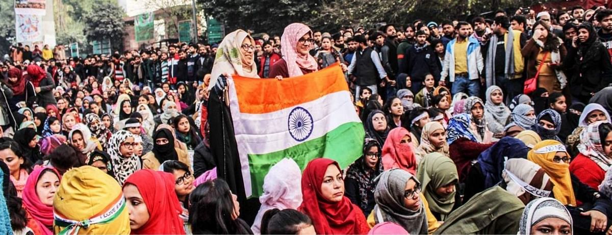 <div class="paragraphs"><p>31 December 2019: Protesters holding the Indian flag at the anti-CAA protest at Jamia Millia Islamia</p></div>