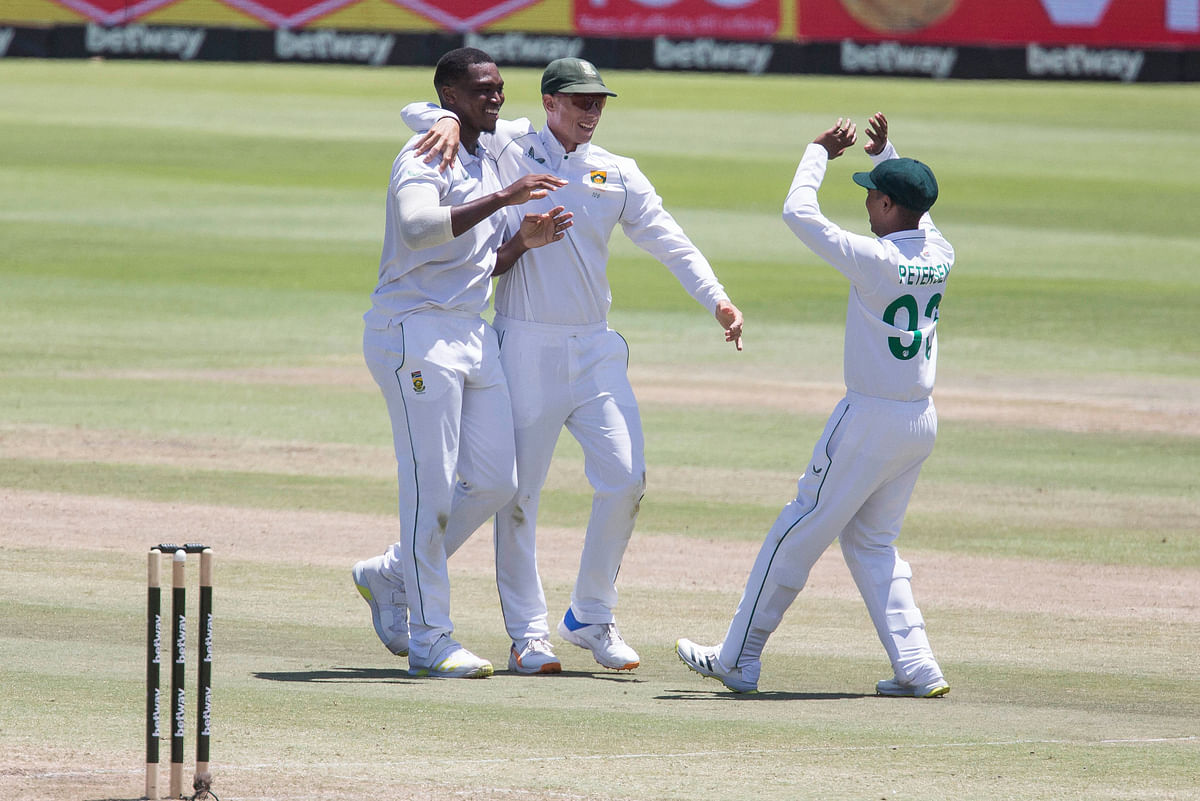 <div class="paragraphs"><p>South African bowler Lungi Ngidi, left, celebrates the wicket of Virat Kohl with team mates Rassie van Der Dussen and Keegan Peterson during the third day of the third and final test.</p></div>