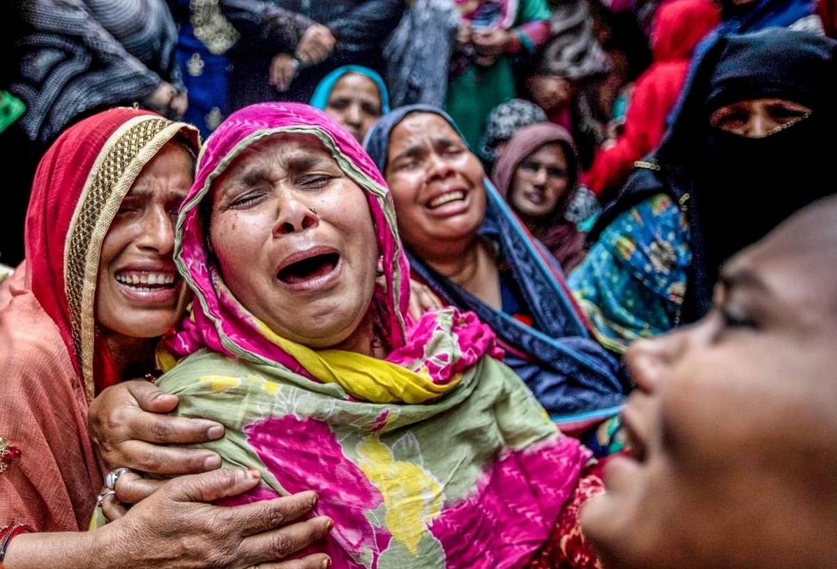<div class="paragraphs"><p>The mother of 17-year-old Mohammad Hashim and 23-year-old Mohammad Amir cries helplessly after her sons are killed by a Hindu mob</p></div>
