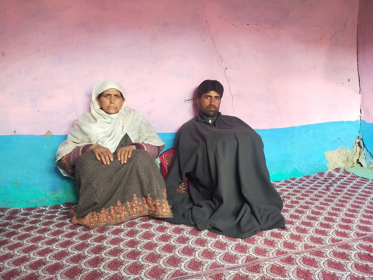 <div class="paragraphs"><p>Parvaiz and Hafeeza sitting in a room with cracked walls in their native village at Shahgund.</p></div>