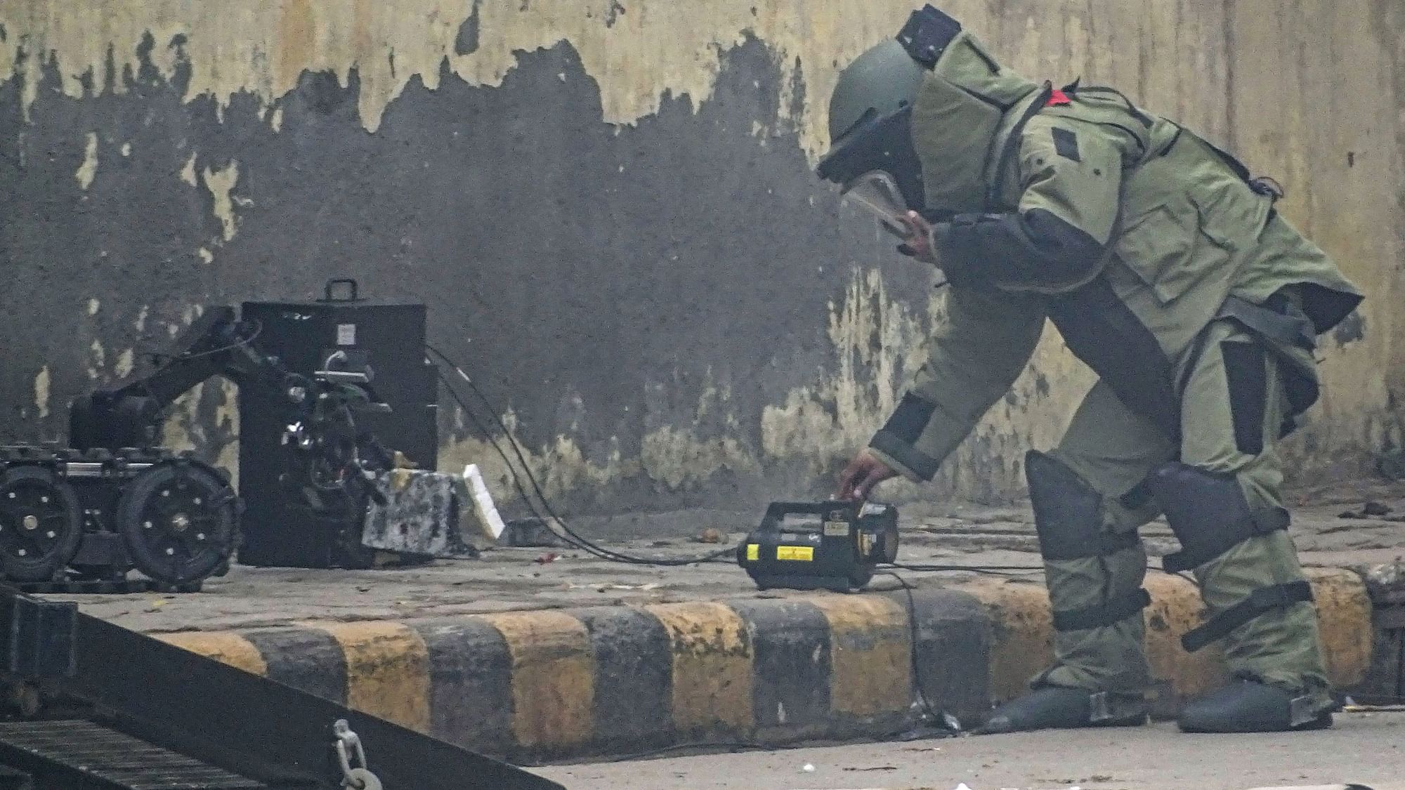 <div class="paragraphs"><p>Representative image of a member of a Bomb Disposal Squad attempting to defuse an IED bomb found inside a bag at Ghazipur flower market in New Delhi.</p></div>