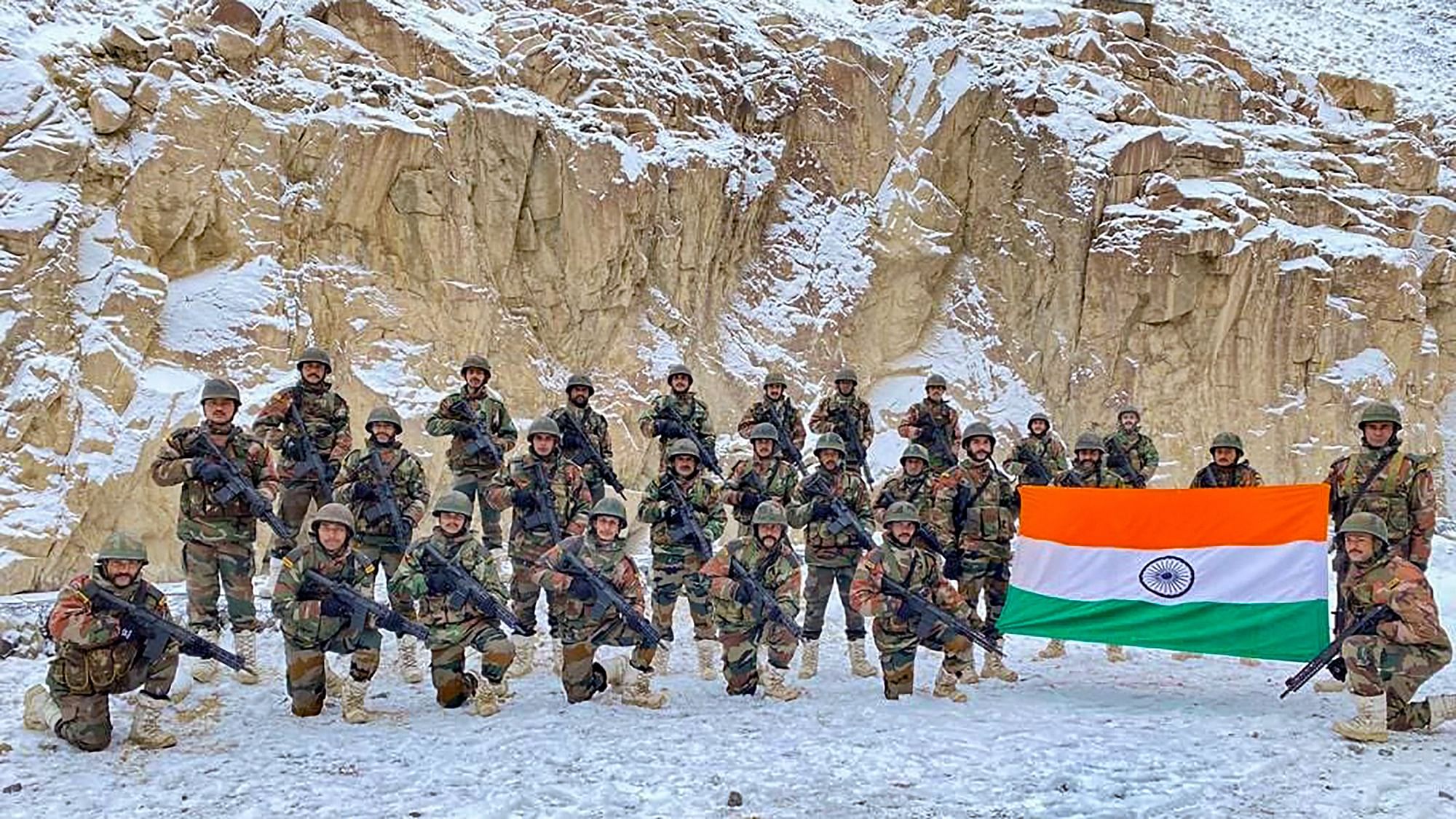 <div class="paragraphs"><p>Indian Army soldiers pose for a photograph with the national flag on the occasion of New Year 2022, at the Galwan Valley in Ladakh. Representational image.</p></div>
