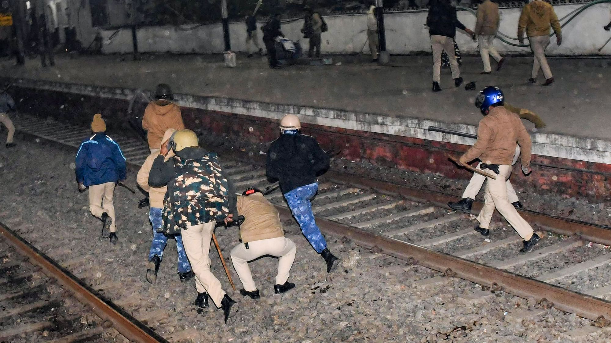 <div class="paragraphs"><p>Police chase the aspirants who blocked railway tracks to protest over alleged erroneous results of Railway Recruitment Boards Non-Technical Popular Categories (RRB NTPC) exam, at the Rajendra Nagar Terminal railway station, in Patna, Monday, 24 January.</p></div>