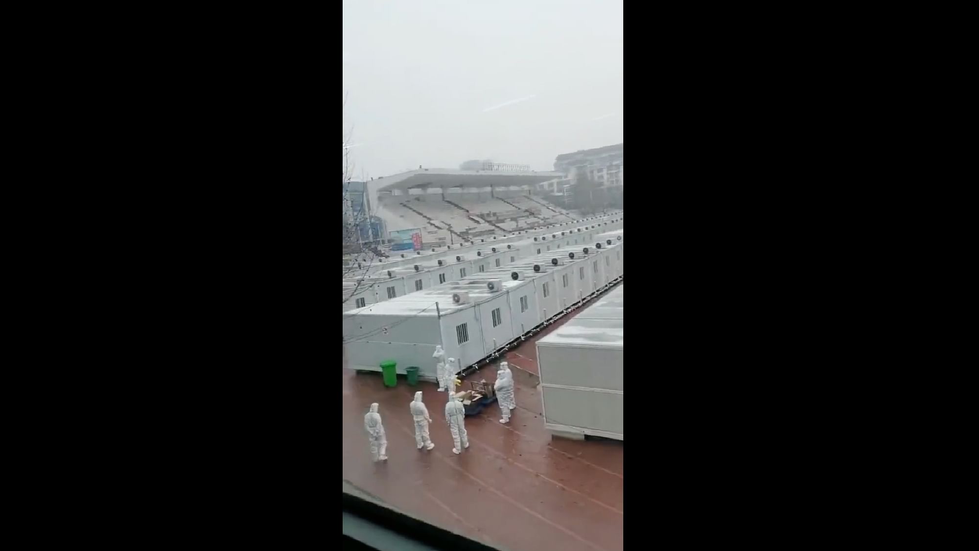 <div class="paragraphs"><p>Workers in Hazmat suits having a discussion outside the metal boxes in which COVID positive people are being forced to live in China.&nbsp;</p></div>