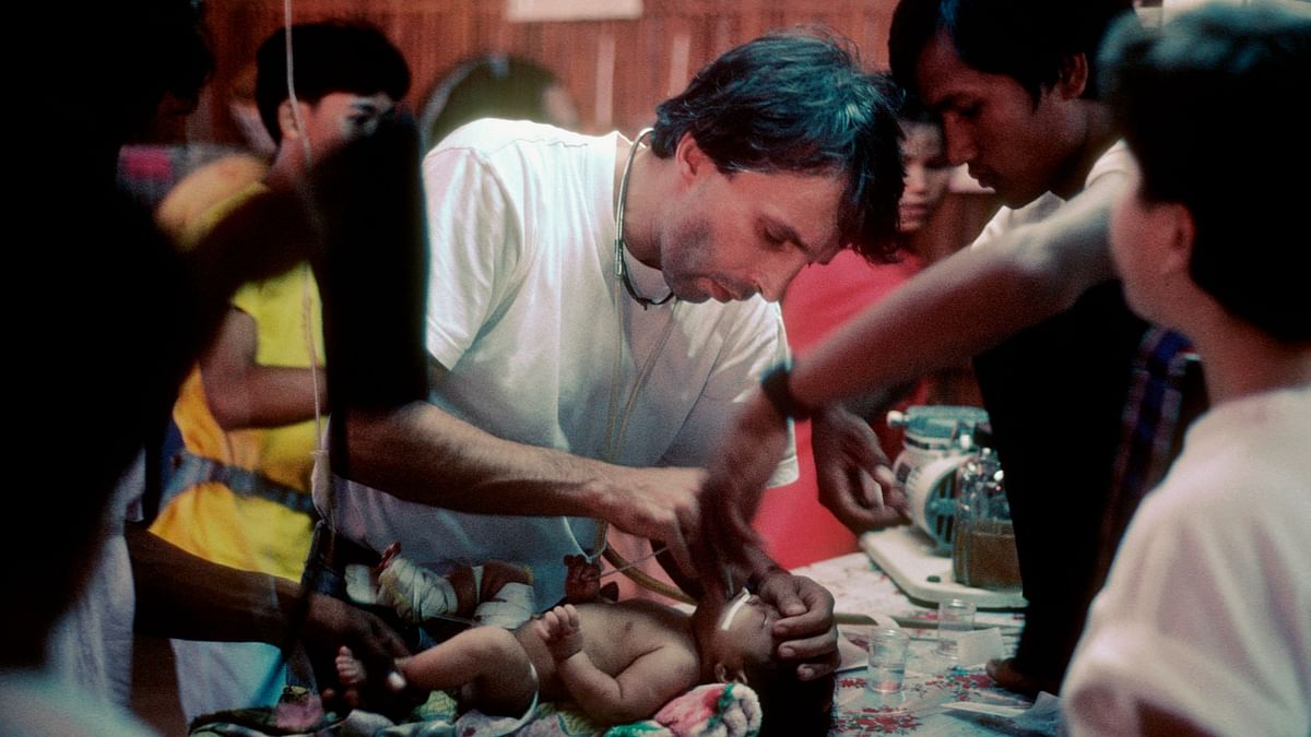 <div class="paragraphs"><p>Yves Coyette, an MSF doctor, treats a sick baby in Khao I Dang refugee camp. Thailand 1984.</p></div>