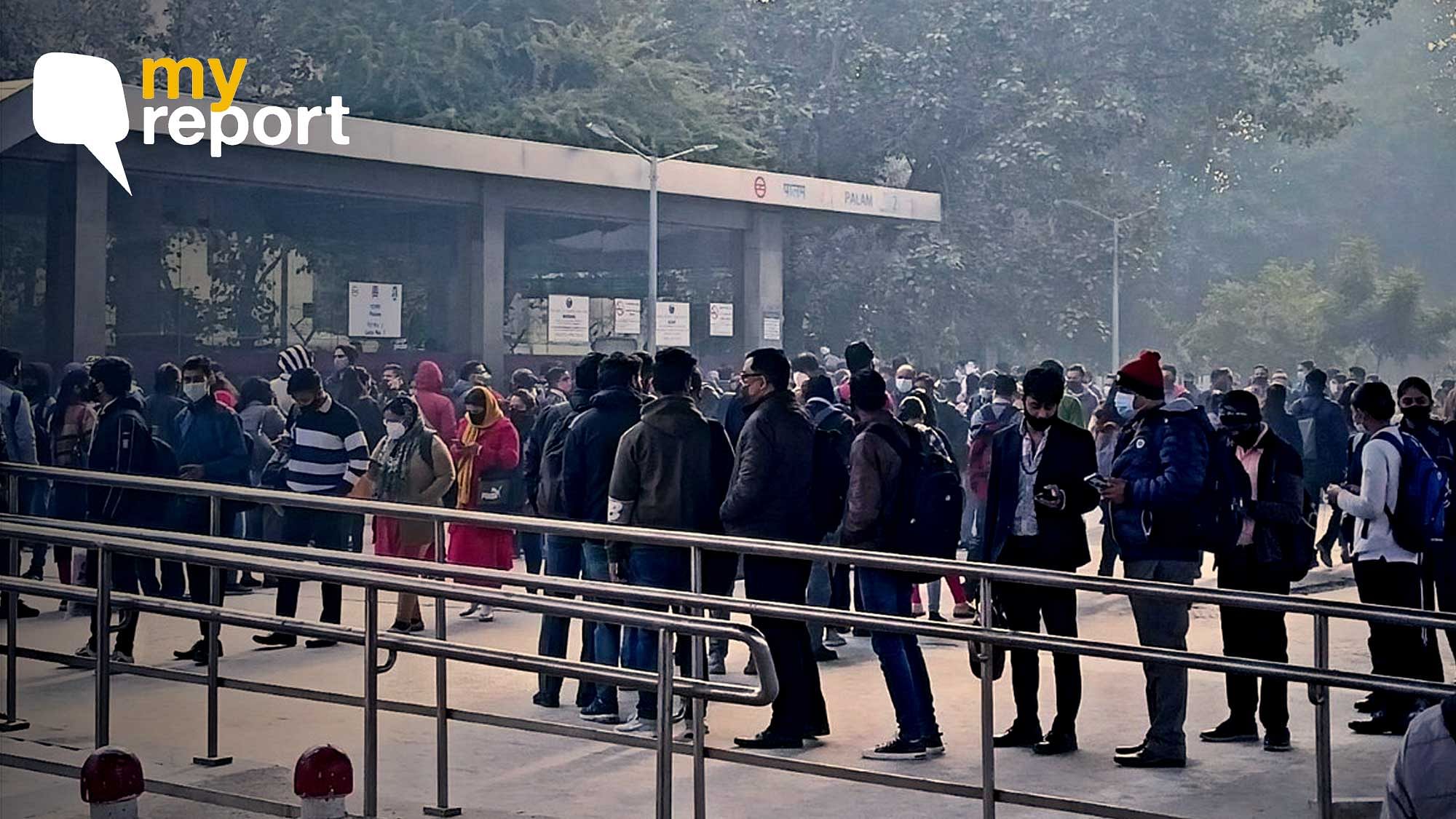 <div class="paragraphs"><p>Commuters waiting outside the metro station.</p></div>