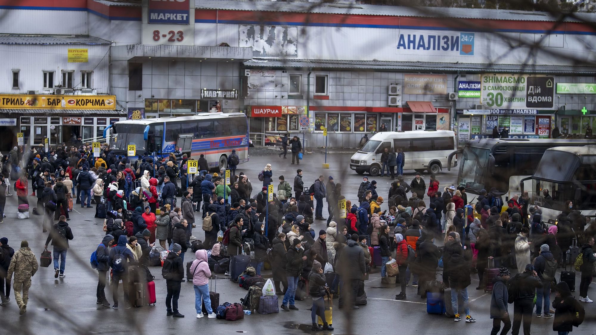 <div class="paragraphs"><p>People wait for buses as they leave Kyiv, Ukraine, on Thursday, 24 February.</p></div>