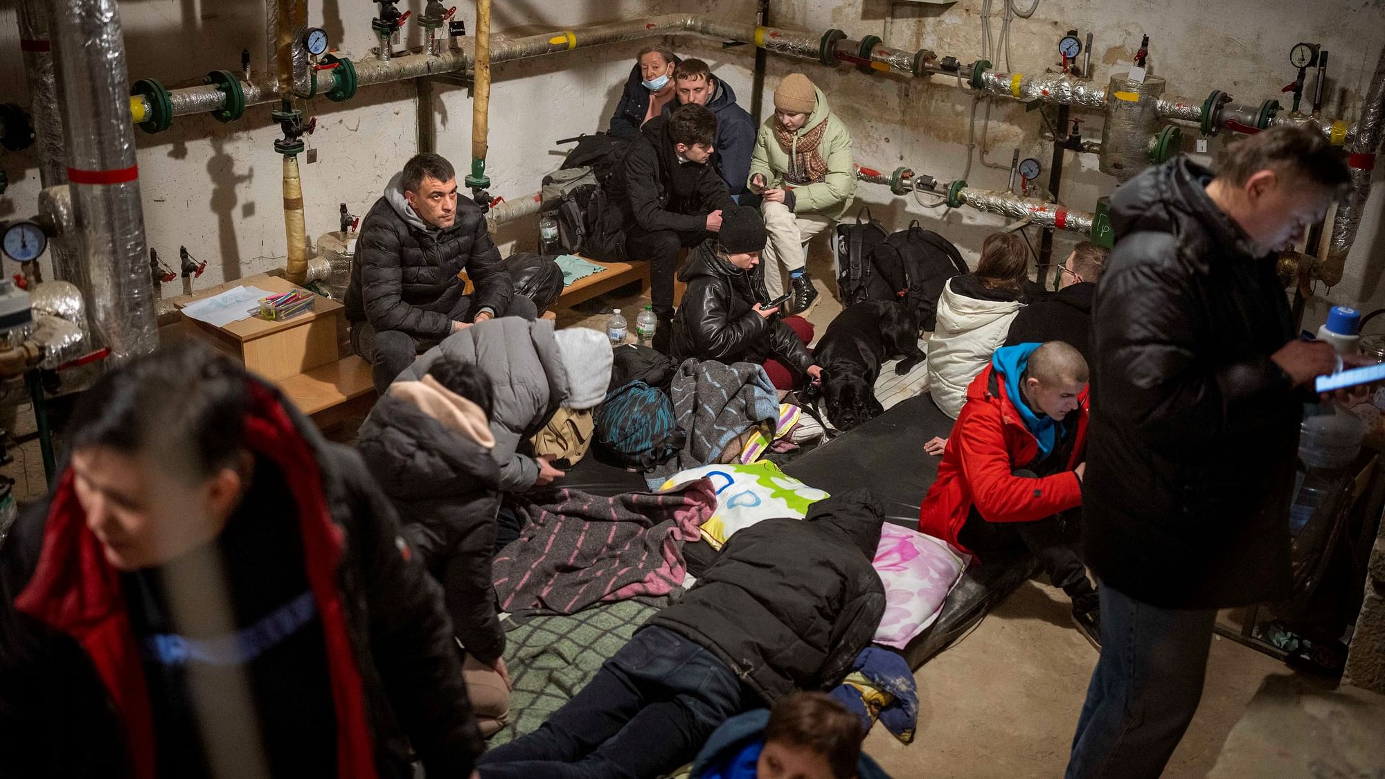 <div class="paragraphs"><p>People take shelter at a building basement in the city of Kyiv.<br><br></p></div>