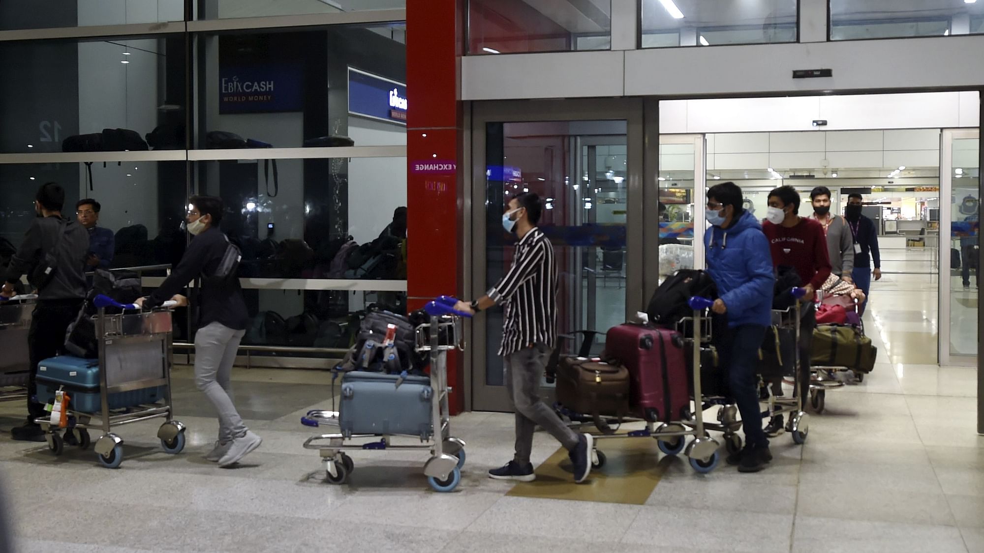 <div class="paragraphs"><p>Indian nationals come out from the IGI Airport on their arrival by an Air India flight from Ukraine amid rising Russia-Ukraine tension, in New Delhi on Wednesday.</p></div>