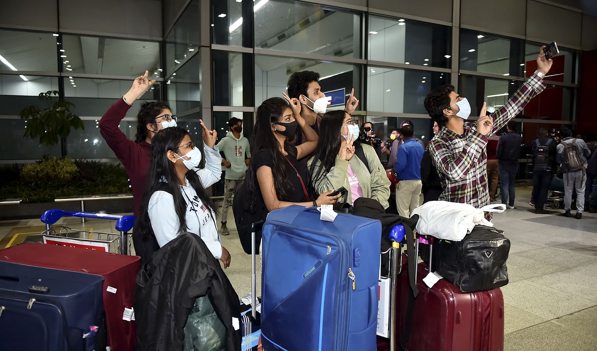 <div class="paragraphs"><p>Indian nationals take selfie upon their arrival at the IGI Airport by an Air India flight from Ukraine amid rising Russia-Ukraine tension, in New Delhi, Wednesday, Feb 23.</p></div>