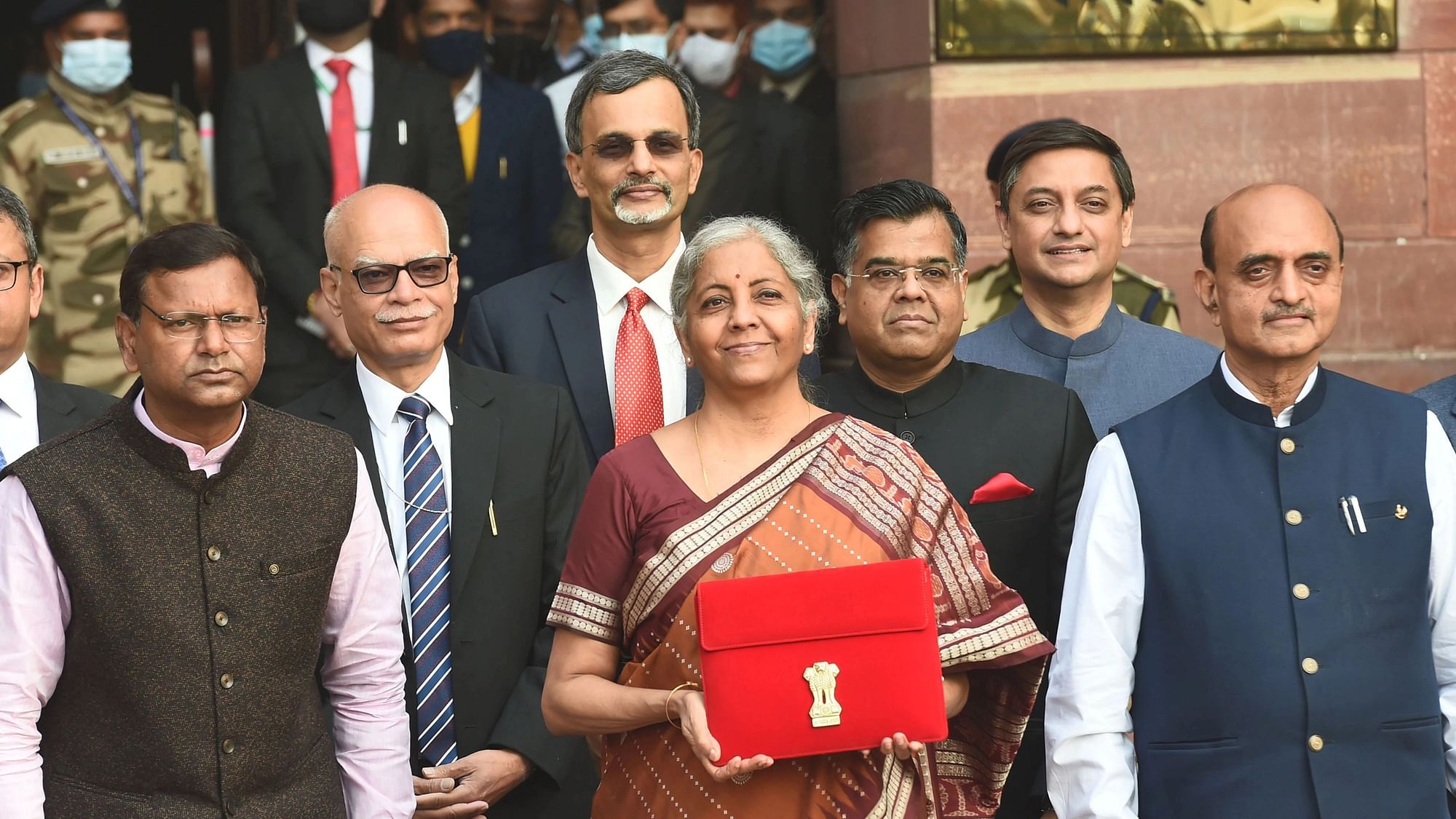 <div class="paragraphs"><p>New Delhi: Union Finance Minister Nirmala Sitharaman holds a folder-case containing the Union Budget 2022-23 as she poses for a group photograph with MoS Finance Pankaj Chaudhary and officials of the Finance Ministry, at North Block in New Delhi, Tuesday, 1 February. Sitharaman presented her fourth Union Budget in the Parliament on this day.</p></div>