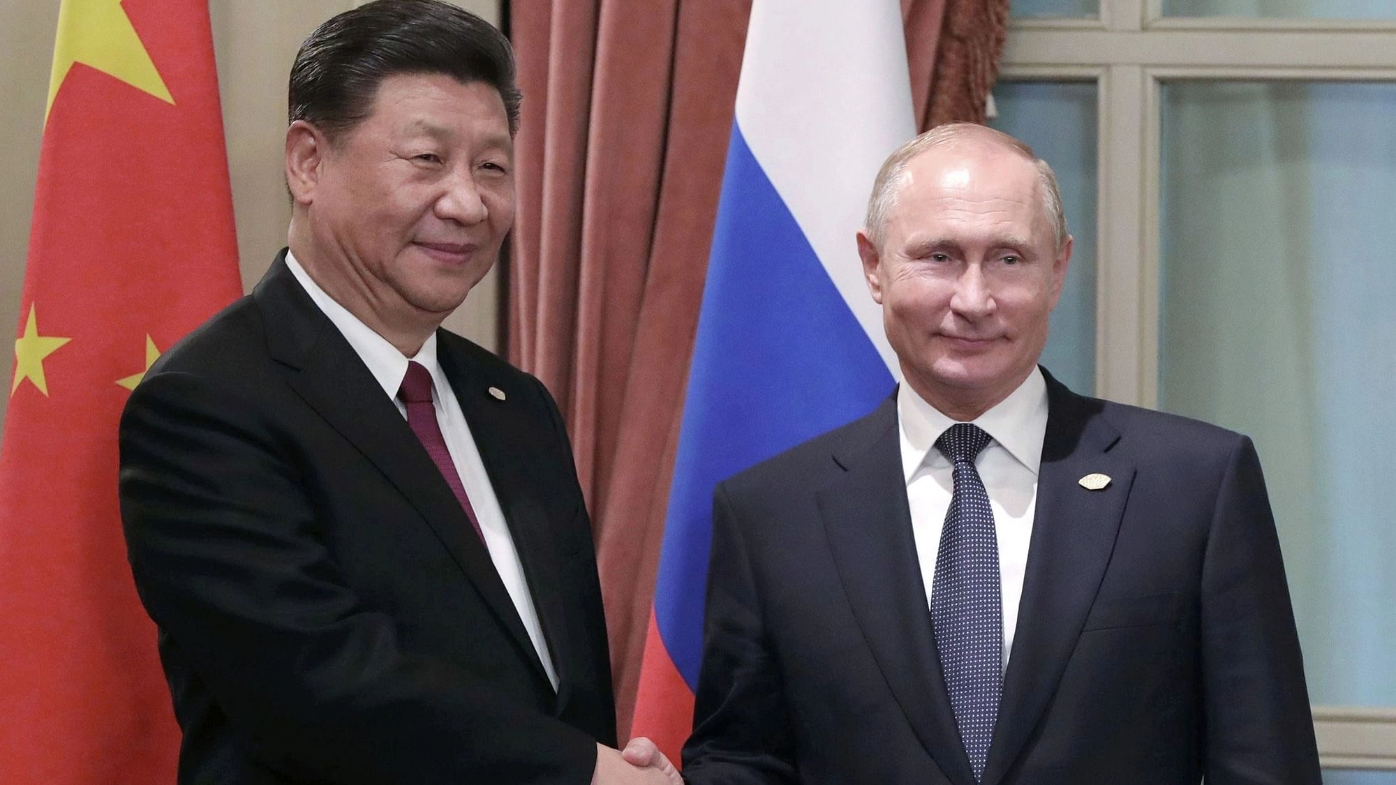 <div class="paragraphs"><p>Russian President Vladimir Putin, (right) with Chinese President Xi Jinping.</p></div>