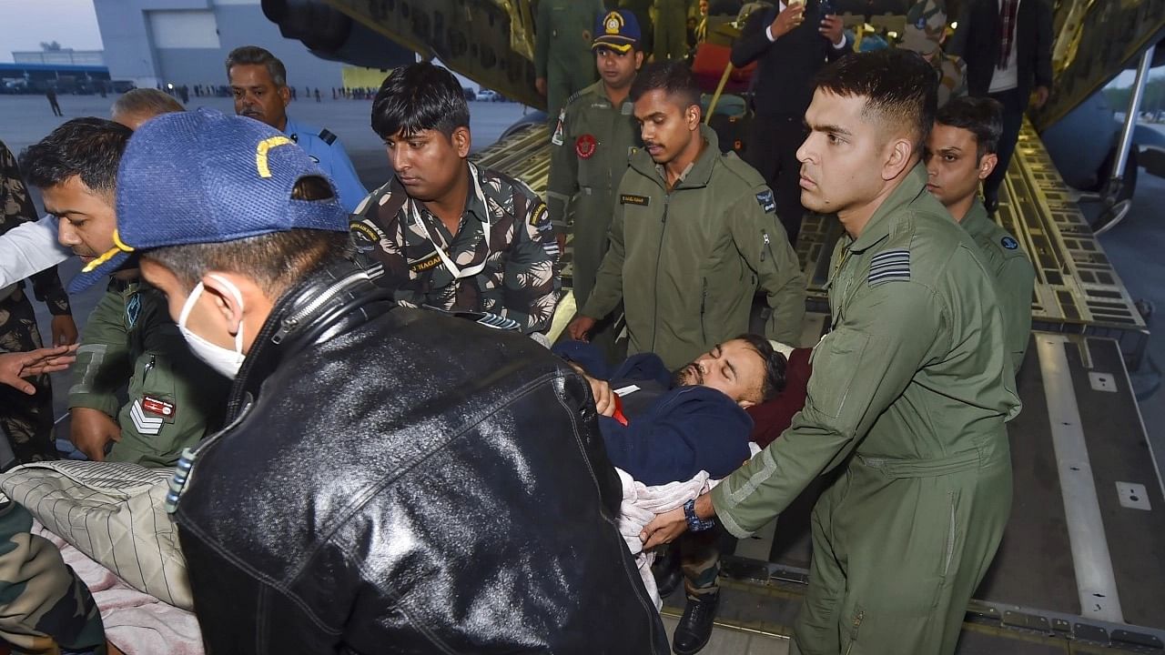 <div class="paragraphs"><p>Injured Indian national Harjot Singh is assisted off the aircraft after being evacuated from war-torn Ukraine upon his arrival at the Hindon Airport in Ghaziabad.</p></div>