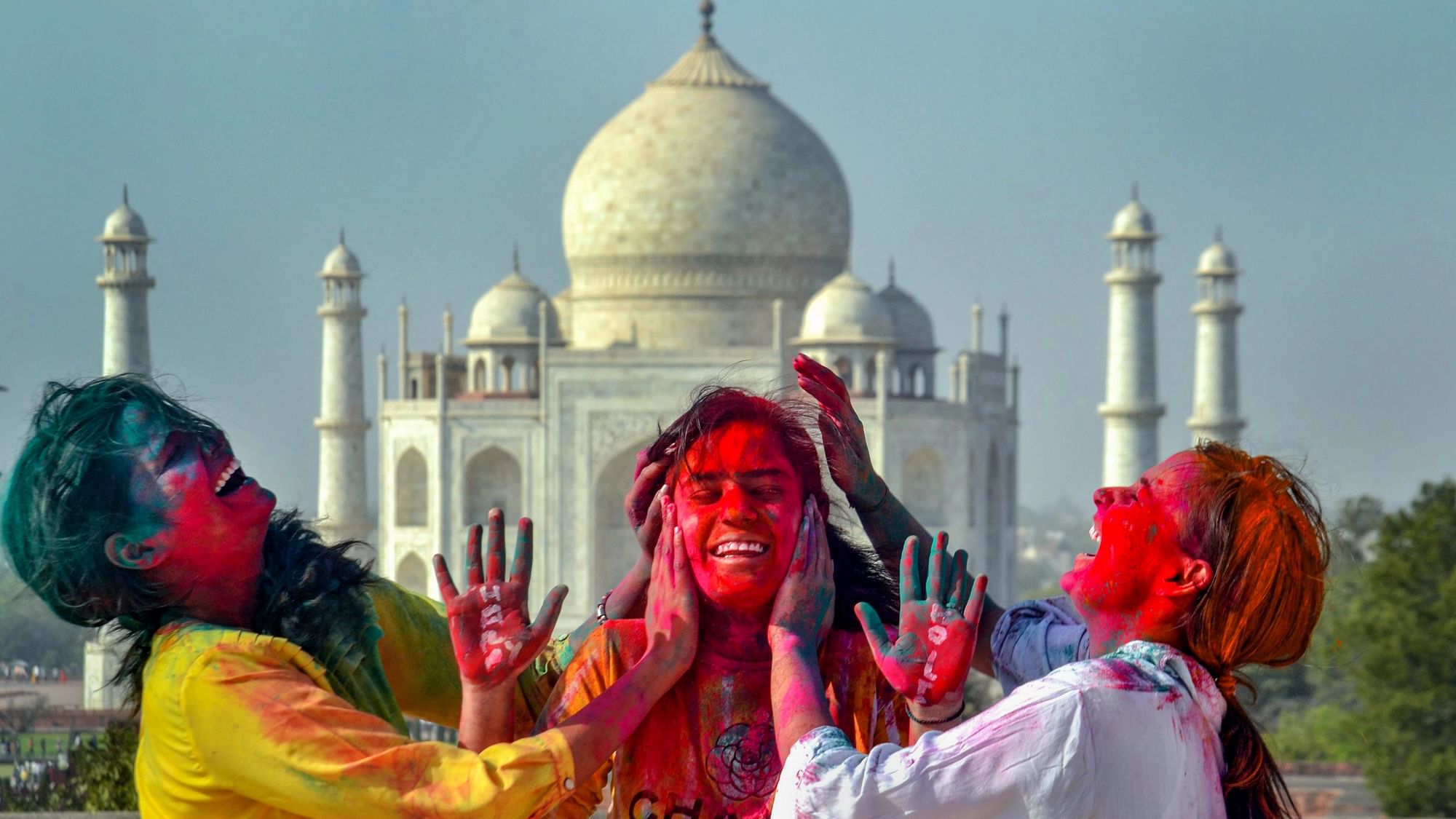 <div class="paragraphs"><p>Agra: Young women celebrate Holi at the Taj Mahal complex, in Agra, Wednesday, 16 March.</p></div>
