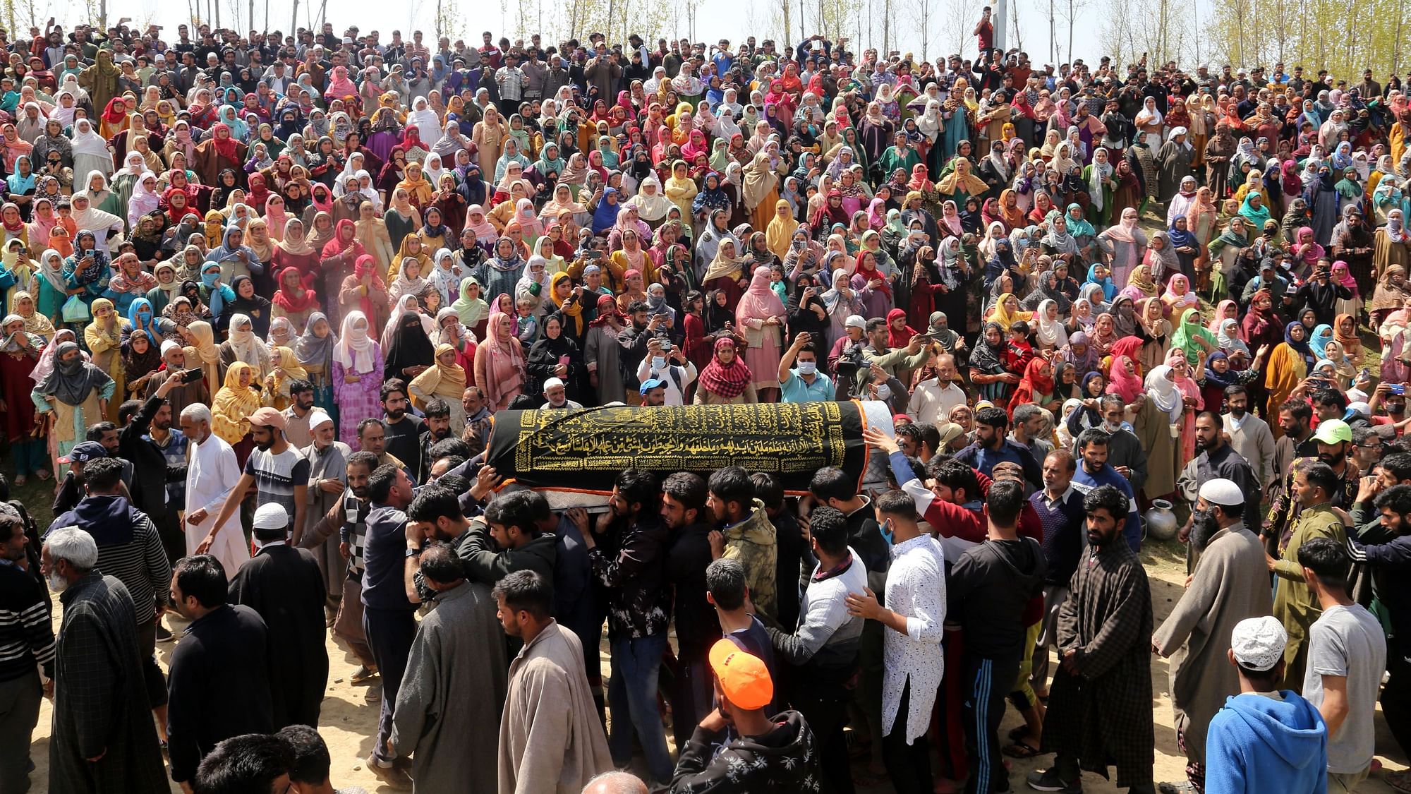 <div class="paragraphs"><p>Scores of mourners attended the funeral of the two brothers on 27 March.</p></div>