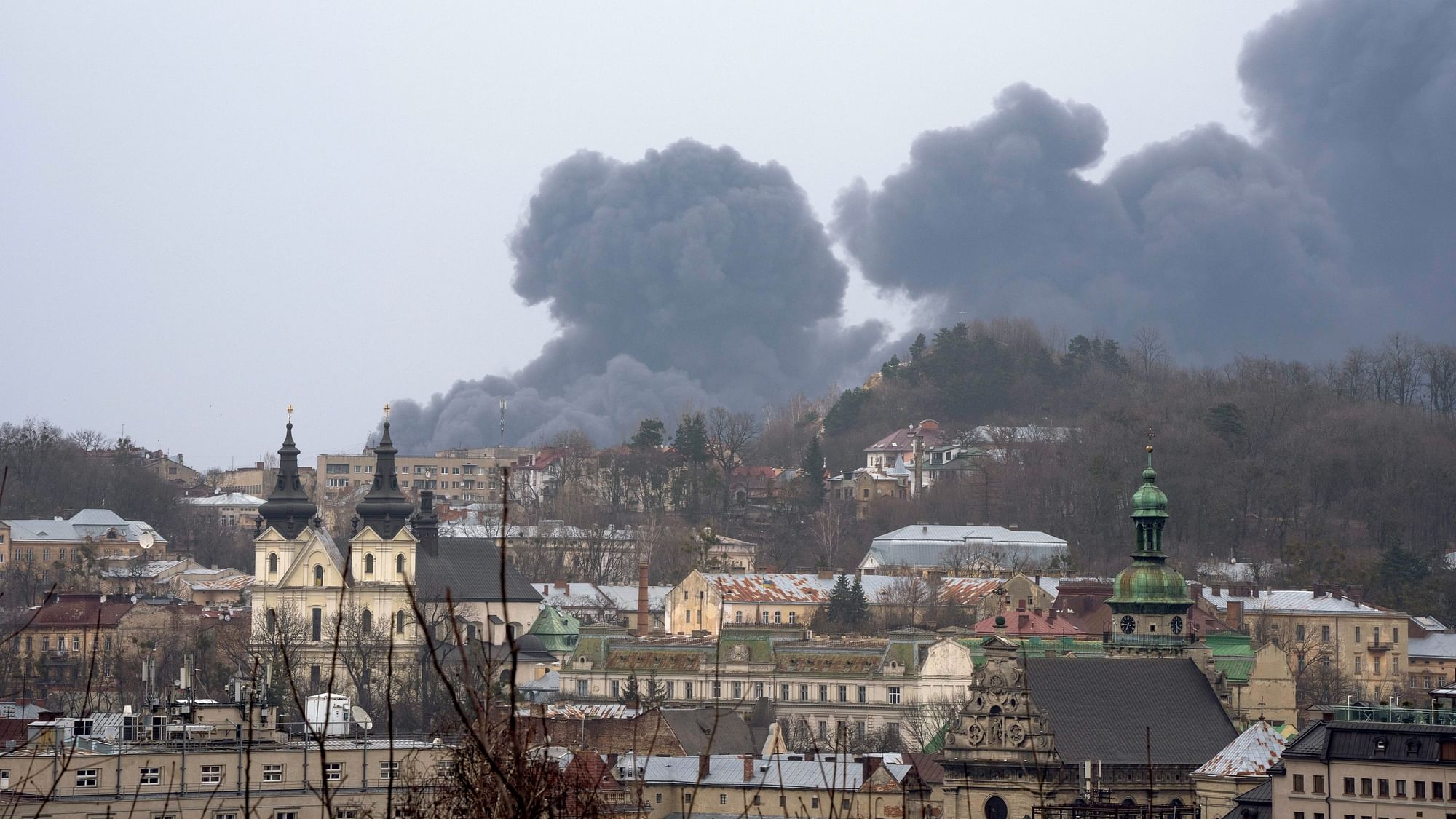 <div class="paragraphs"><p>Smoke rises in the air in Lviv, western Ukraine as Russia continues to strike and encircle urban populations, from Chernihiv and Kharkiv in the north to Mariupol in the south.</p></div>