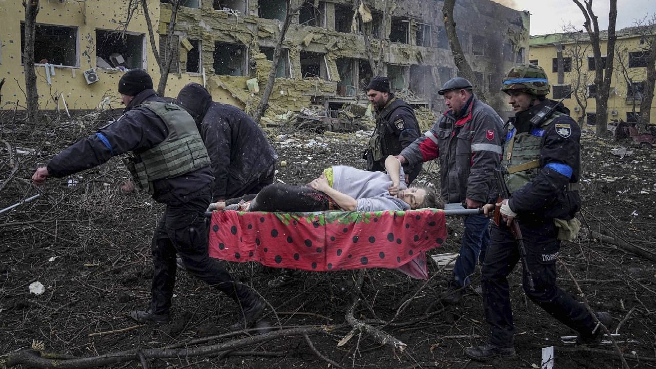 <div class="paragraphs"><p>An injured Ukrainian woman being carried in a stretcher.&nbsp;</p></div>