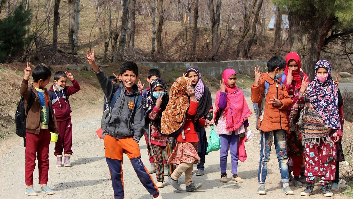 <div class="paragraphs"><p>Children express their excitement as they walk to their school for offline classes after a gap of almost 32 months.</p></div>
