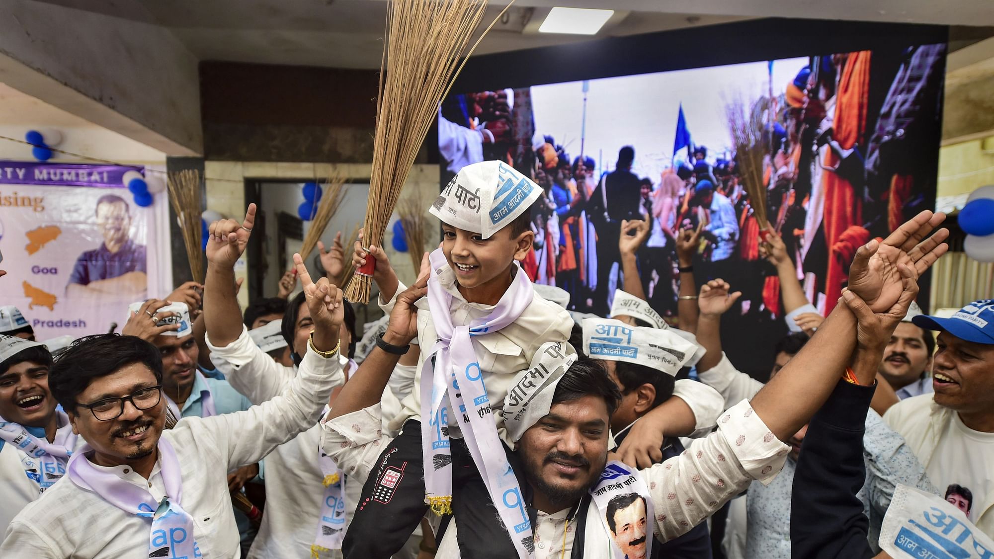 <div class="paragraphs"><p>Aam Aadmi Party (AAP) workers celebrate the party's lead during counting day of Punjab elections.</p></div>
