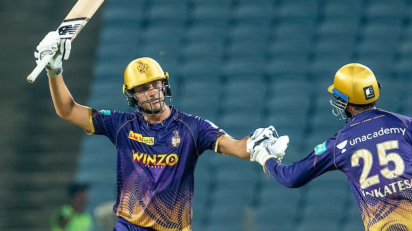 <div class="paragraphs"><p>Pat Cummins of Kolkata Knight Riders raises his bat after scoring a fifty against Mumbai Indians.</p></div>