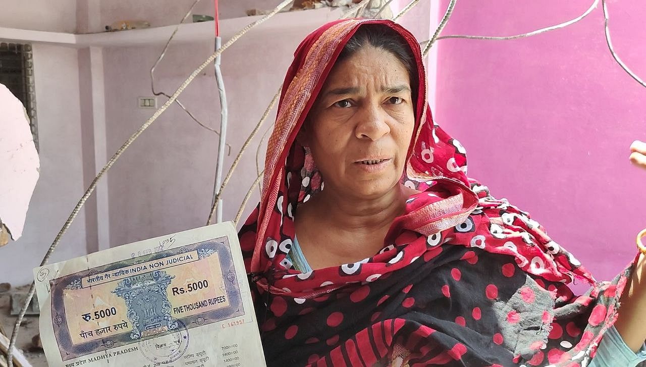 <div class="paragraphs"><p>Holding the registration of their house, Sakeena, mother of Shahbaz, questioned if her son was in jail, why was their house demolished?</p></div>