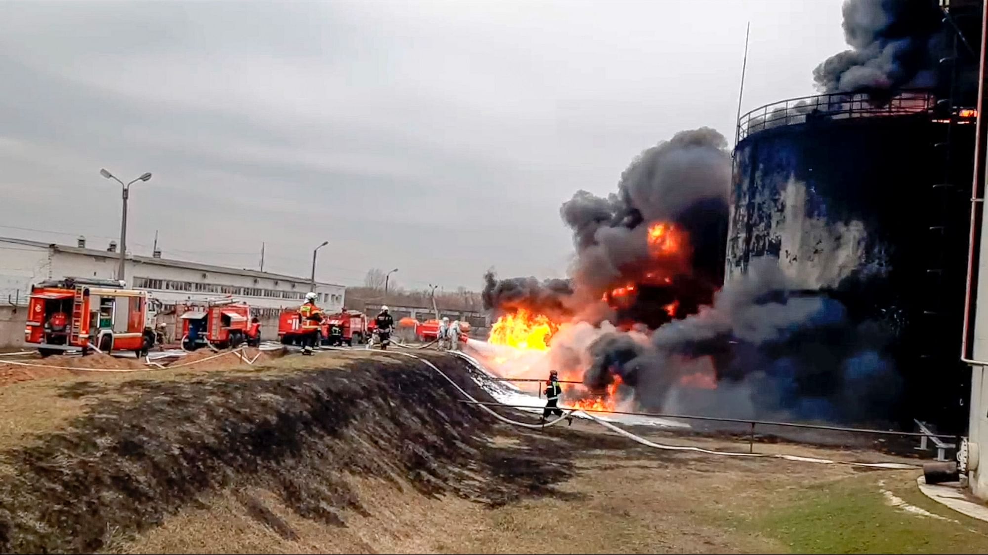 <div class="paragraphs"><p>In this handout photo released by Russian Emergency Ministry Press Service on Friday, April 1, 2022, firefighters work at the site of fire at an oil depot in Belgorod region, Russia. </p></div>