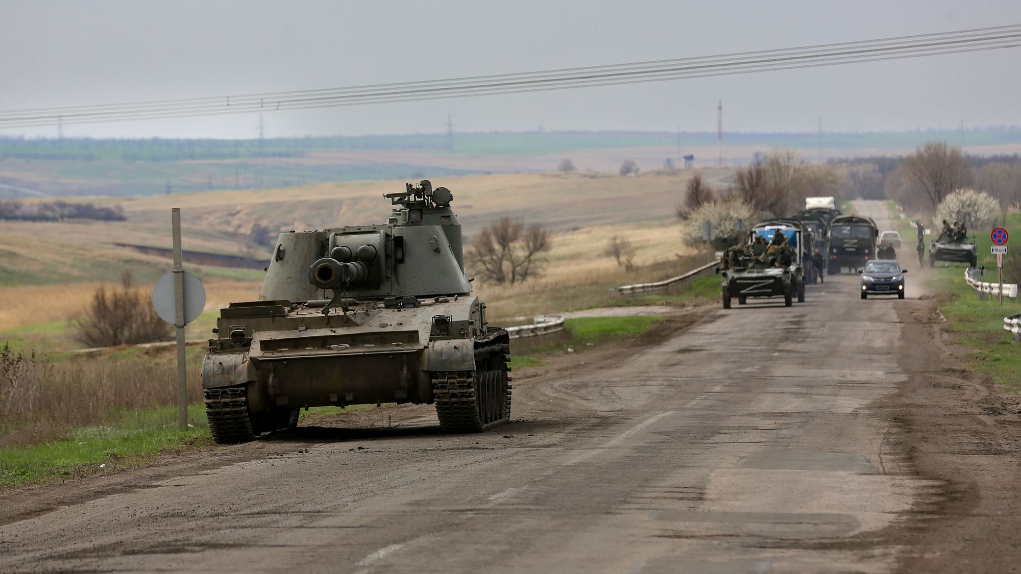 <div class="paragraphs"><p>Russian military vehicles move on a highway in an area controlled by Russian-backed separatist forces near Mariupol, Ukraine.</p></div>