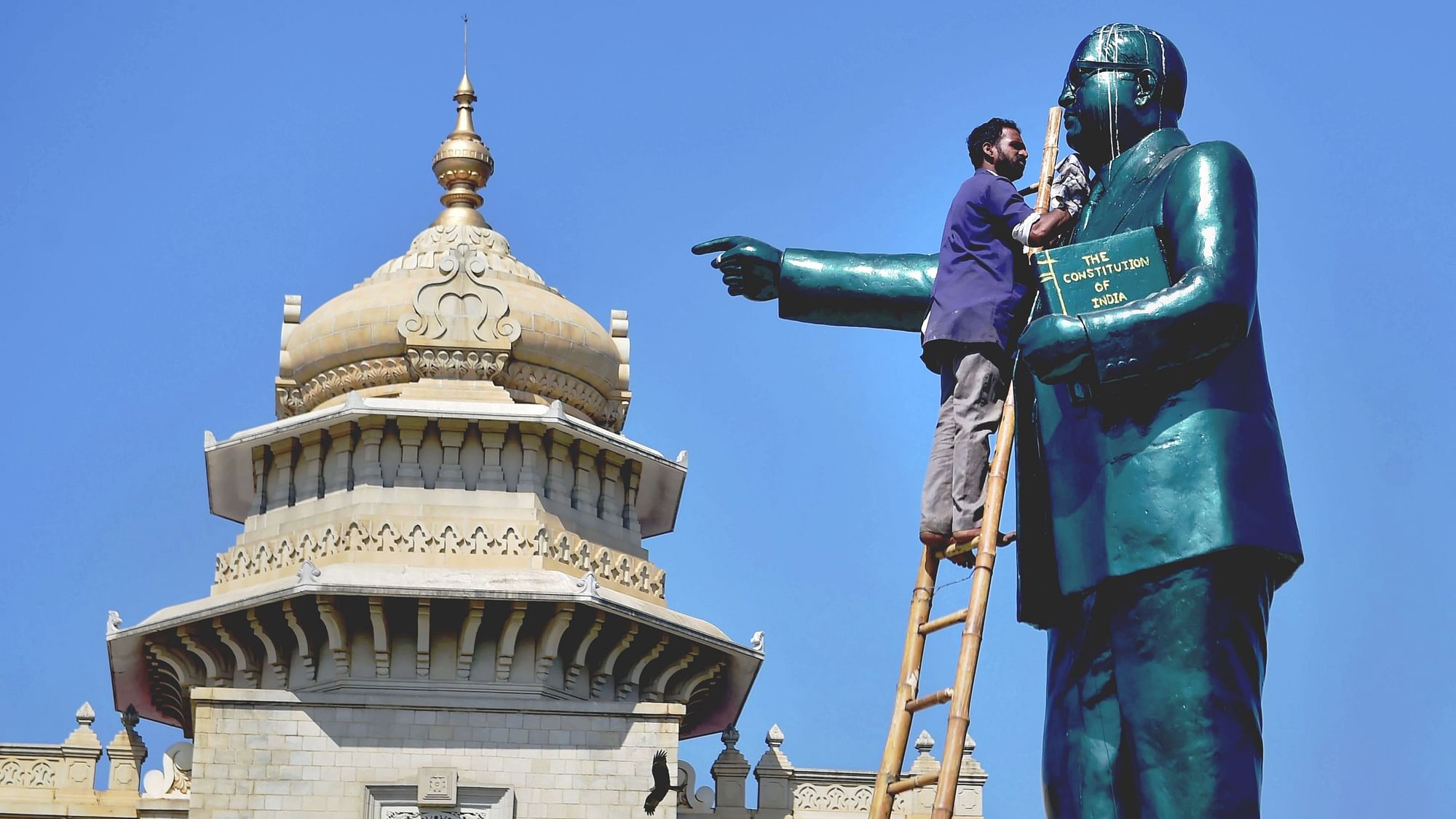 <div class="paragraphs"><p>Ambedkar Jayanti: A file photo of a worker cleaning a statue of Babasaheb Ambedkar at Vidhanasoudha in Bengaluru. Photo for representation.&nbsp;</p></div>