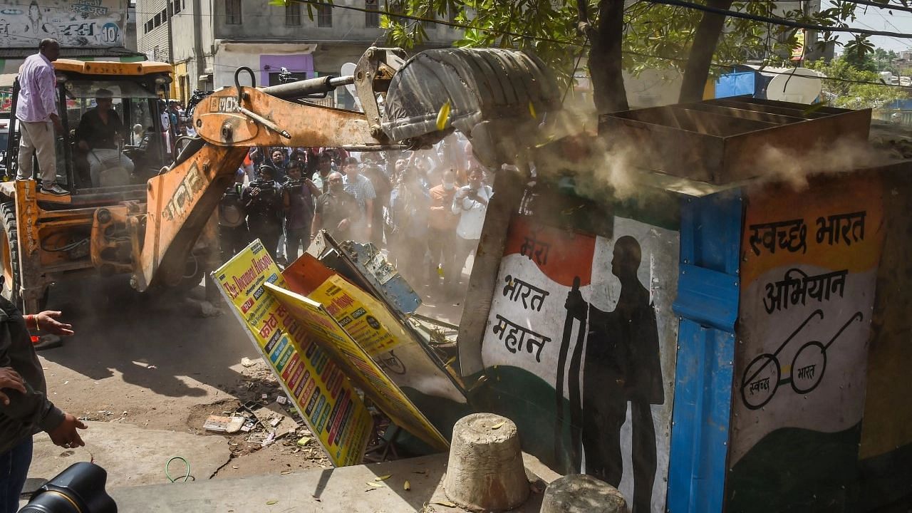 <div class="paragraphs"><p>Alleged illegal structures during a joint anti-encroachment drive by the North Delhi Municipal Corporation (NDMC), PWD, local bodies and the police, in the violence-hit Jahangirpuri area in New Delhi, on Wednesday, 20 April.</p></div>