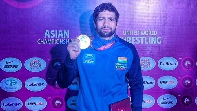 <div class="paragraphs"><p>Ravi Dahiya poses with the Gold medal.</p></div>