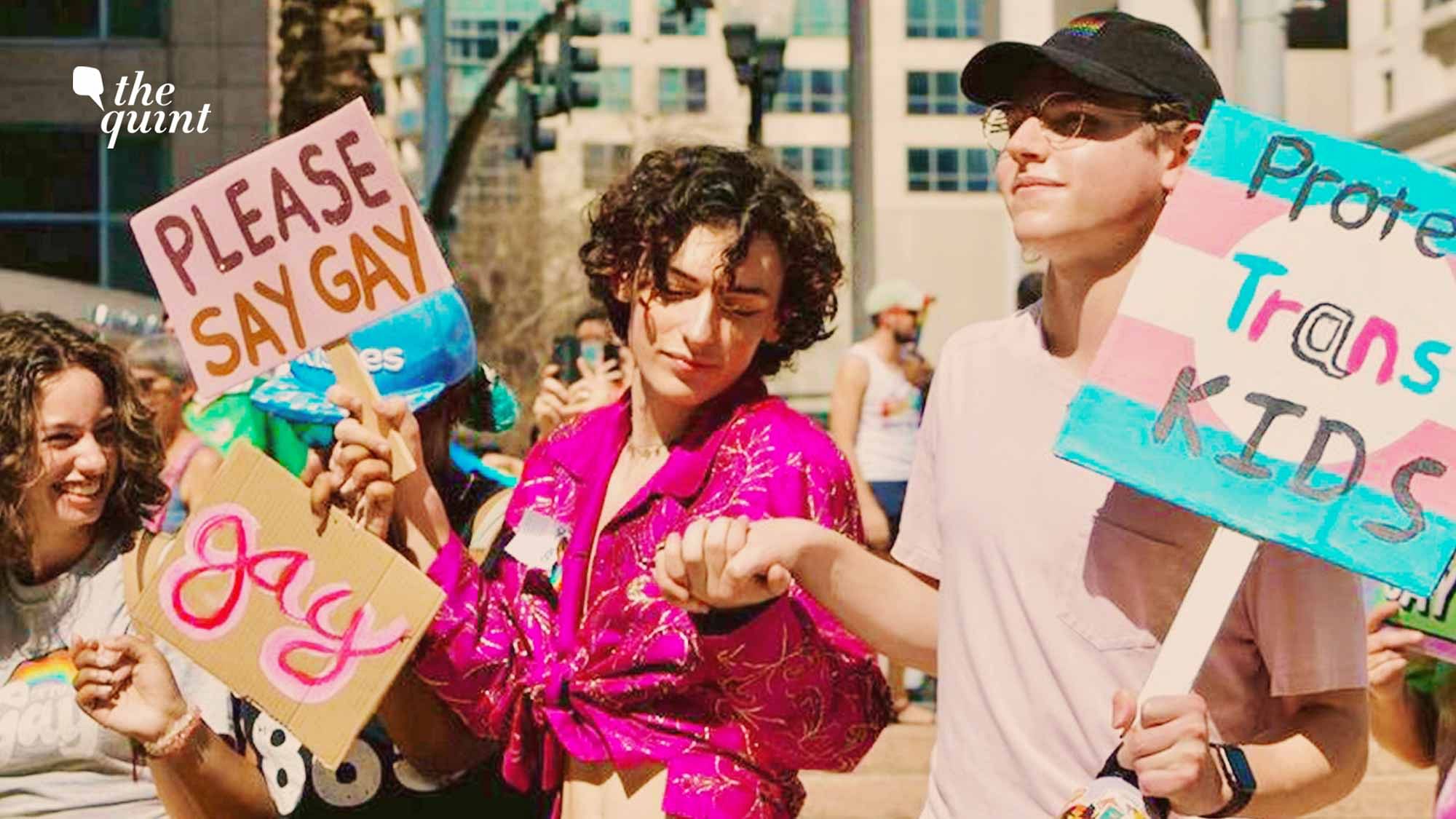 <div class="paragraphs"><p>On left, Will Larkins, Co-Founder and President of Queer Student Union at Winter Park High School, Florida at a 'Say Gay Anyway' Event, protesting  'Don't Say Gay'.</p></div>