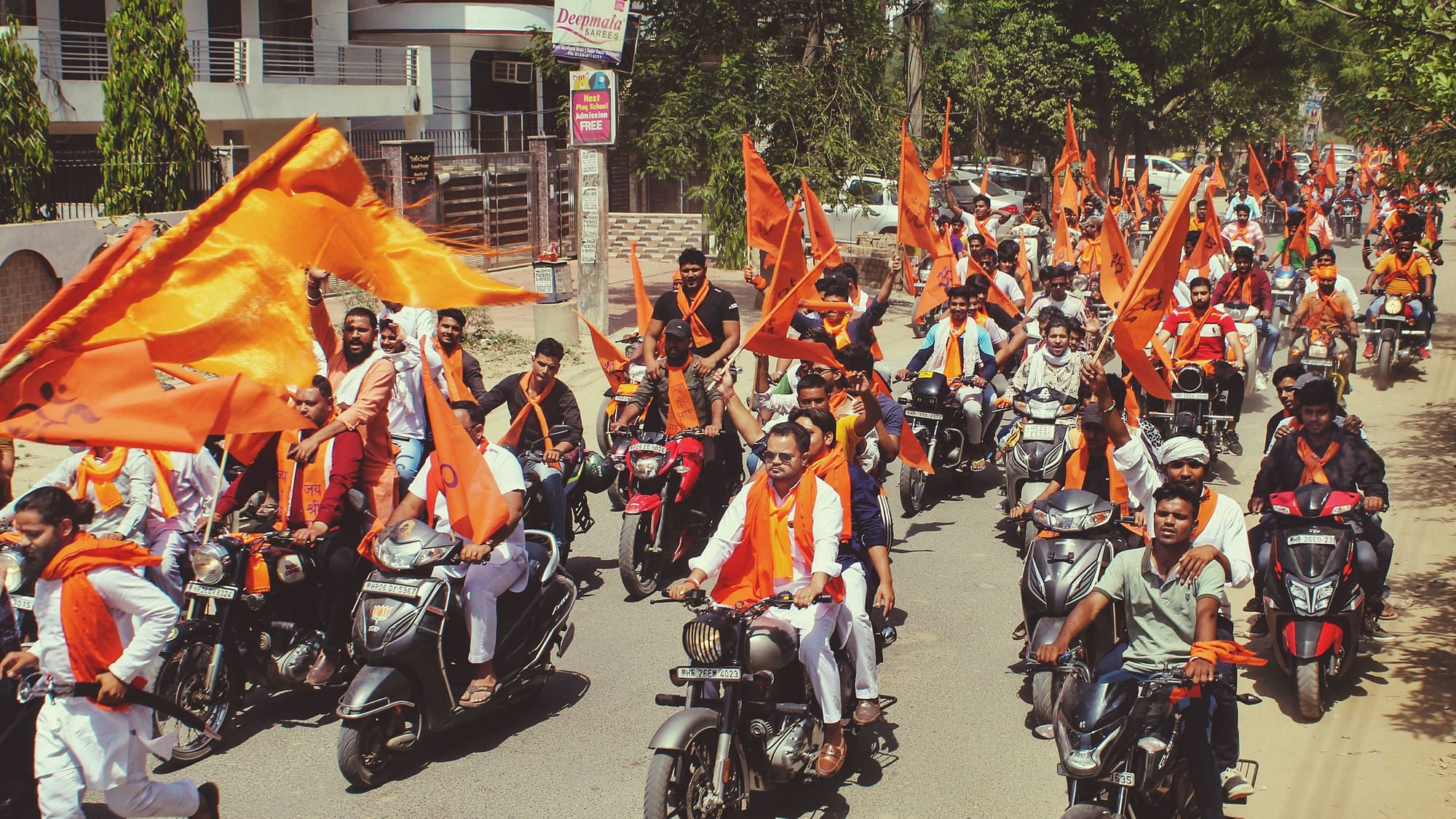 <div class="paragraphs"><p>Bajrang Dal and Vishva Hindu Parishad supporters wave saffron flags in Gurugram as they participate in Saffron Yatra on the occasion of Ram Navami on Sunday, 10 April.</p></div>