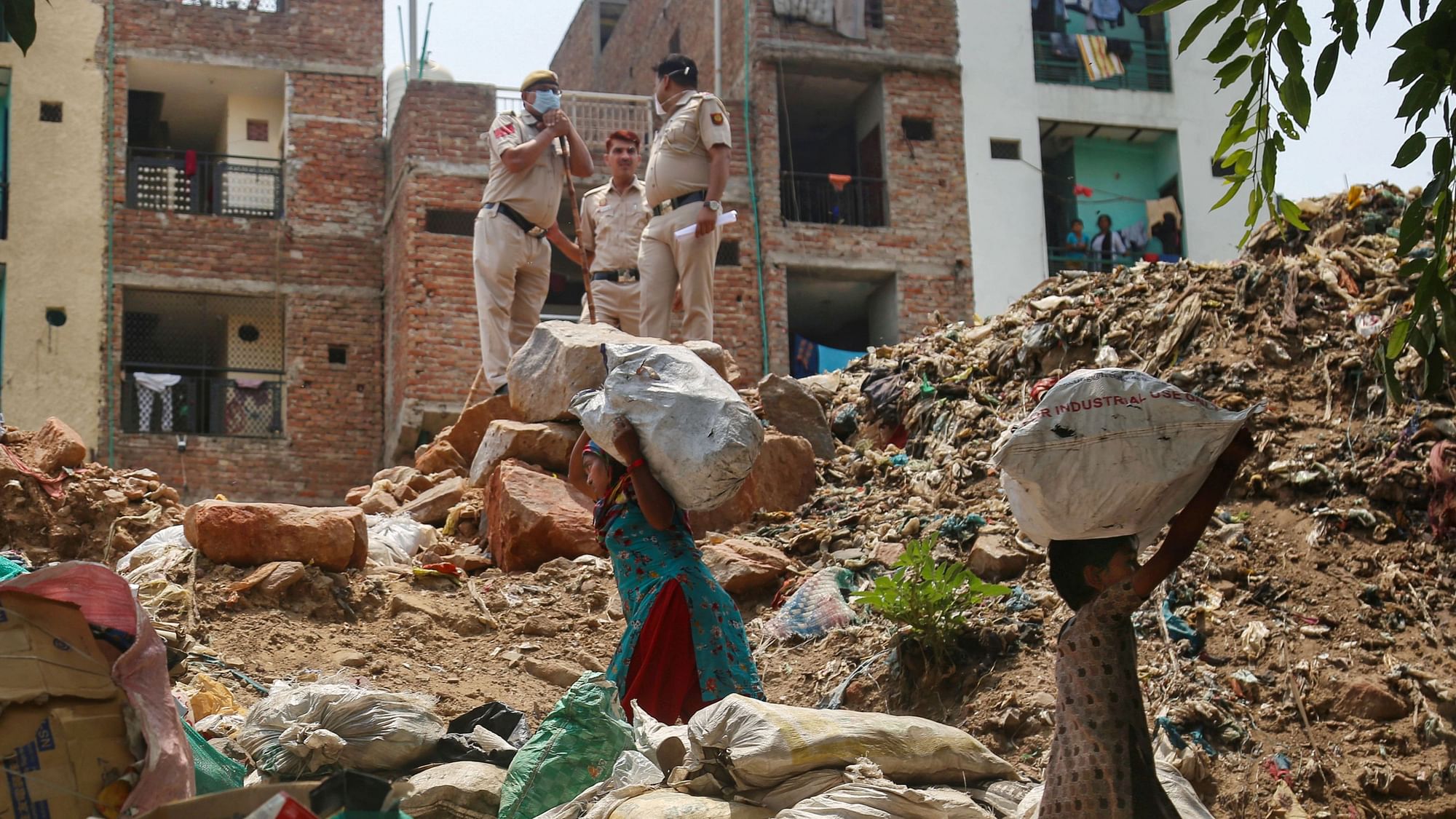 <div class="paragraphs"><p>Locals carry their belongings during an anti-encroachment drive in New Delhi. Image used for representational purposes.</p></div>