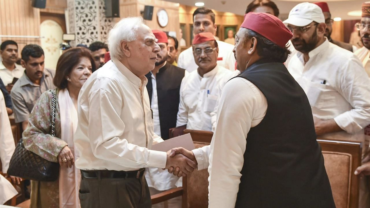 <div class="paragraphs"><p>Former Congress leader Kapil Sibal greets Samajwadi Party President Akhilesh Yadav as he files his nomination papers for Rajya Sabha.</p></div>