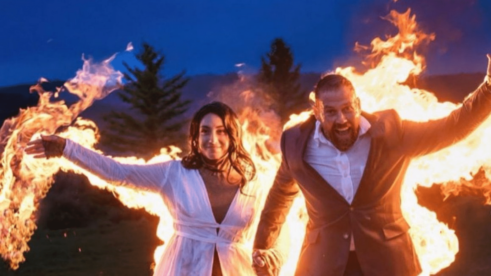 <div class="paragraphs"><p>Couple exits wedding on fire in unique stunt.</p></div>