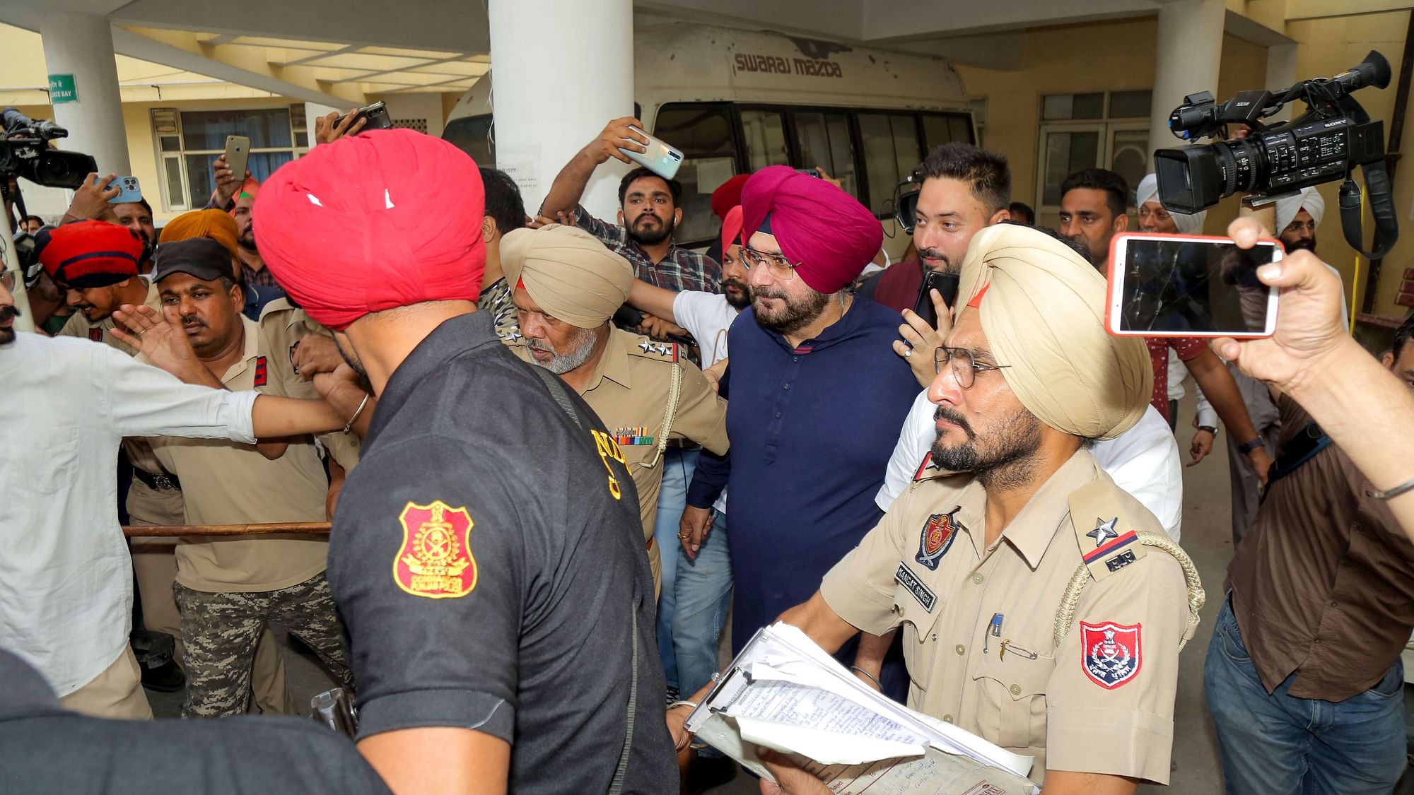 <div class="paragraphs"><p>Congress leader Navjot Singh Sidhu comes out after his medical examination following his surrender in the Patiala court, at Mata Kaushalya Hospita.</p></div>