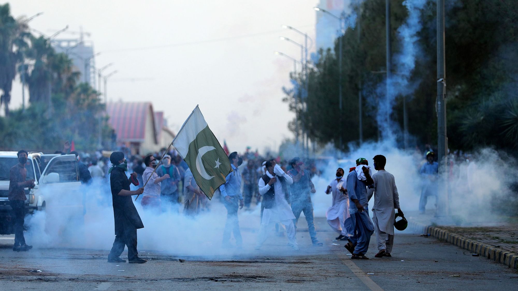 <div class="paragraphs"><p>Police fire tear gas to disperse supporters of Pakistans key opposition party, in Islamabad, Pakistan, on Wednesday, 25 May.</p></div>