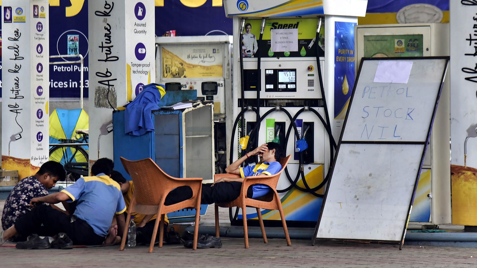 <div class="paragraphs"><p>Guwahati: Employees of a filling station take rest during the 'bandh' called by North East India Petroleum Dealers<em>'</em> Association (NEIPDA) for 24 hours, against alleged unlawful trade practices carried out by oil companies, in Guwahati, Friday, 13 May.</p></div>