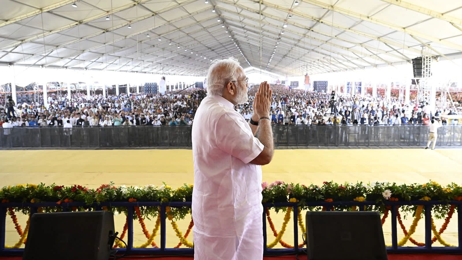 <div class="paragraphs"><p>Prime Minister Narendra Modi greets the crowd in Rajkot, Gujarat.</p></div>