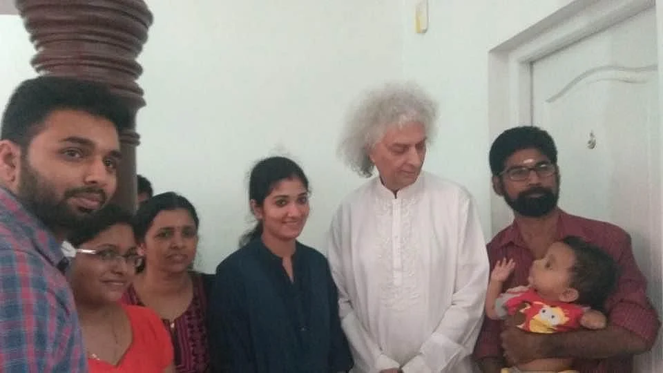 <div class="paragraphs"><p>Haridas and his family with his guruji.</p></div>