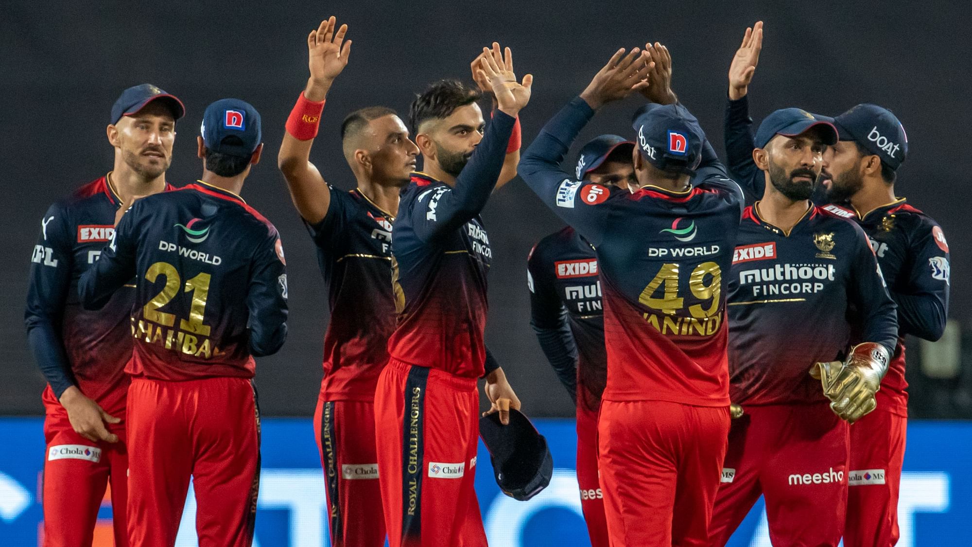 <div class="paragraphs"><p>RCB players celebrate a wicket against CSK.</p></div>