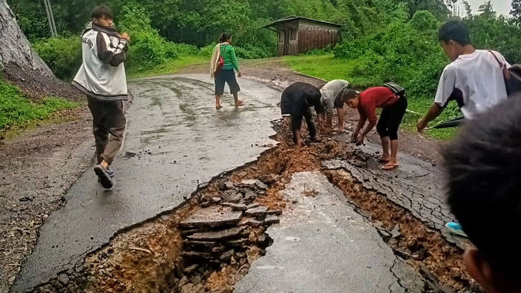 <div class="paragraphs"><p>A damaged road following heavy rainfall in Dima Hasao district of Assam on 17 May.</p></div>