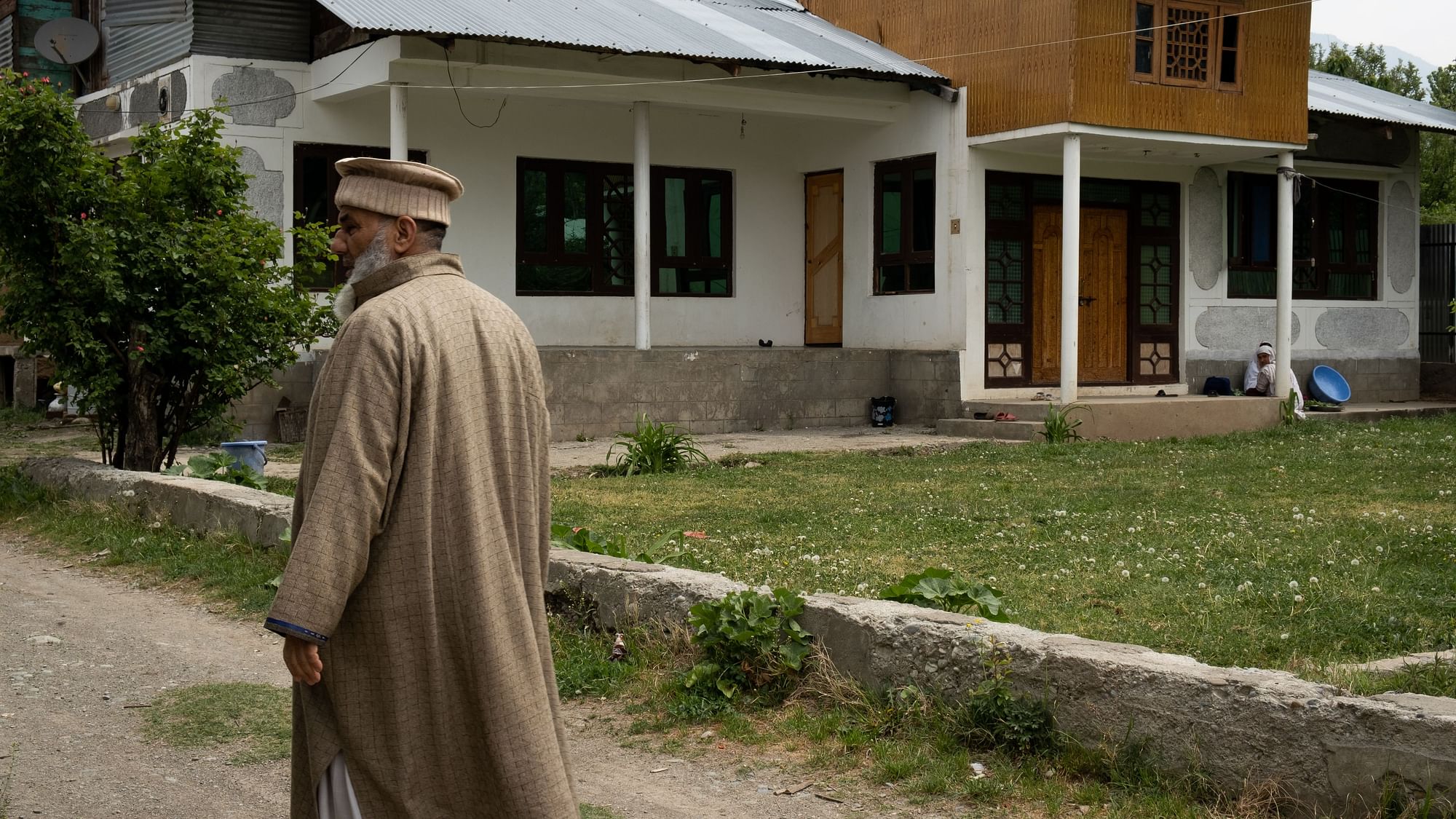 <div class="paragraphs"><p>Haji Mohammad Sharif, head of J&amp;K’s Pashtun community, taking a stroll outside his home.&nbsp;</p></div>