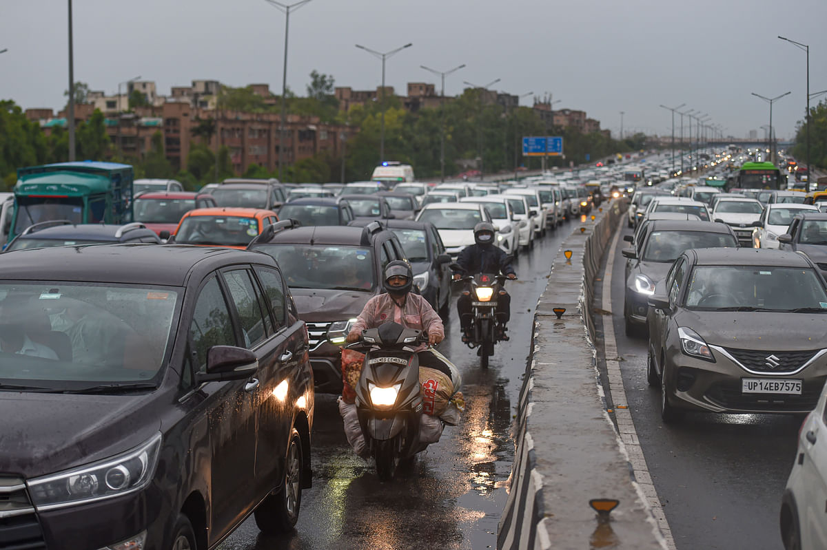 <div class="paragraphs"><p>Vehicles move at a snail's pace during a traffic jam following heavy rain, at Geeta Colony bridge in New Delhi on Monday.</p></div>