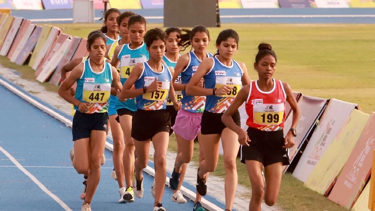 <div class="paragraphs"><p>Supriti Kachhap (in red) from Jharkhand made a national record in the Girls 3000 metre event at the Khelo India Youth Games being held at the Tau Devi Lal Stadium in Panchkula, Haryana today.</p></div>