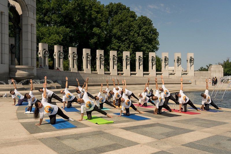 <div class="paragraphs"><p>People practicing Yoga at the World War 2 Memorial in Washington DC.</p></div>