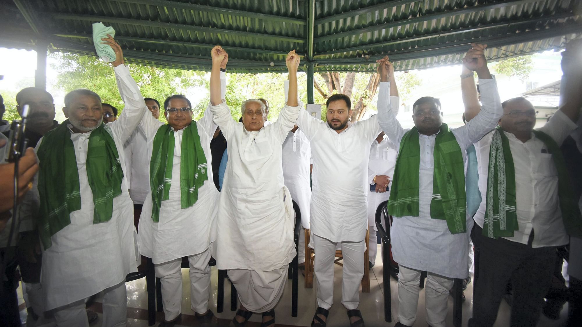<div class="paragraphs"><p>Rashtriya Janata Dal (RJD) leader Tejashwi Yadav with four All India Majlis-e-Ittehad-ul-Muslimeen (AIMIM) MLAs as they join RJD during a press conference, in Patna, Wednesday.</p></div>
