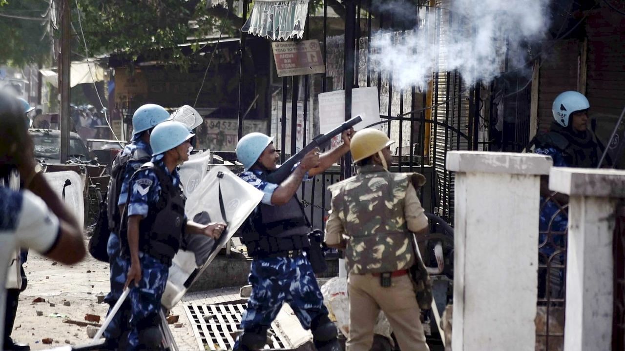 <div class="paragraphs"><p>Police personnel fire tear gas to disperse agitators during a protest over the controversial remarks by two now-suspended BJP leaders against Prophet Mohammad, after the Friday prayer</p></div>